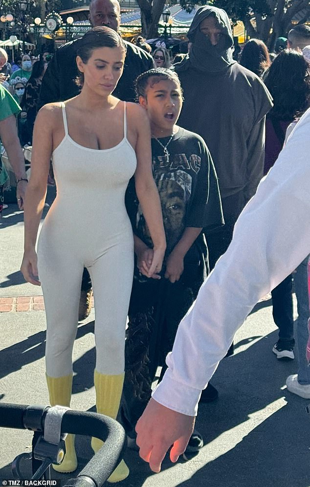 Kanye West and his wife Bianca Censori - dressed in a low-cut leotard - were spotted taking his 10-year-old daughter North to Disneyland on Thursday