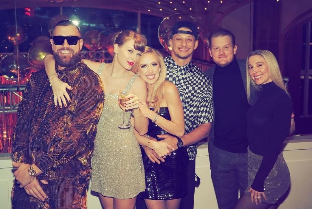 Taylor Swift and Travis Kelce pose with friends and Patrick and Britany Mahomes