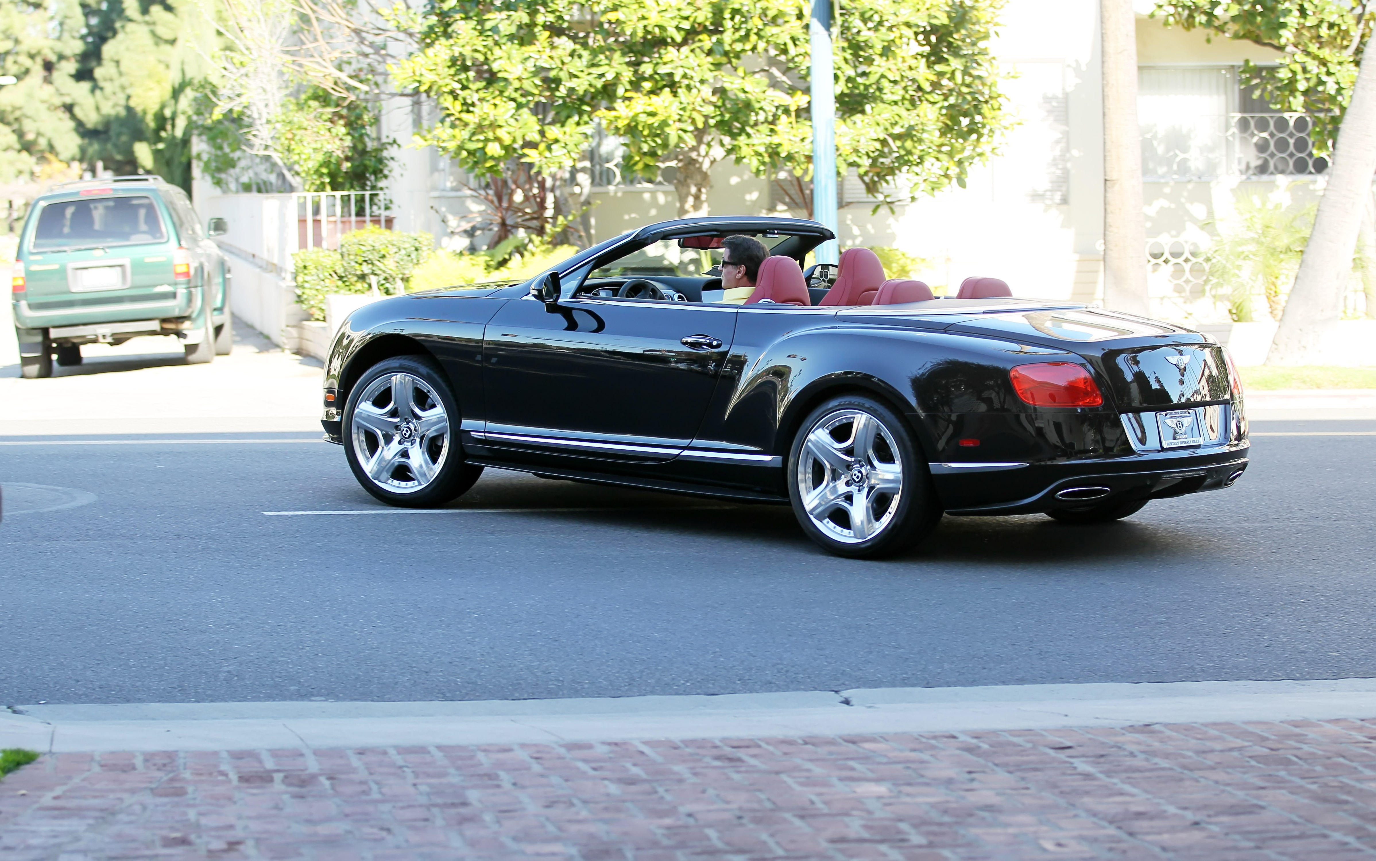 Sly drives his Bentley GT convertible in Beverly Hills
