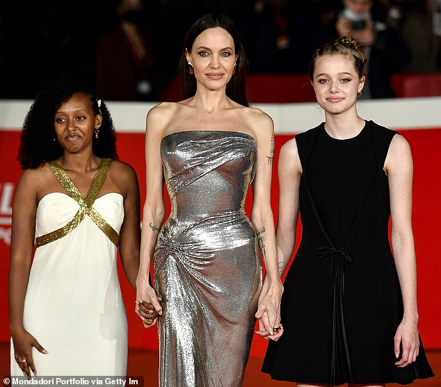 Meanwhile, Pitt's relationship with the six children he shares with ex Angelina Jolie has become increasingly fraught, with the kids dropping 'Pitt' from their names, according to People. Jolie is seen with daughters Zahara (L) and Shiloh (R) in 2021 in Rome