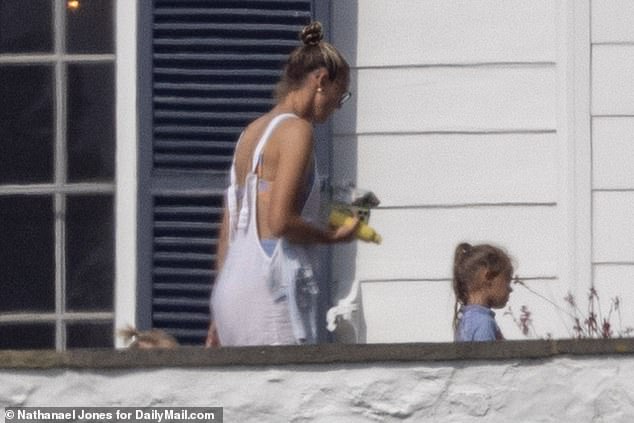 Kylie Kelce also put in an appearance at the birthday bash, donning a baby blue bikini with white dungarees as she accompanied her daughter to the pool